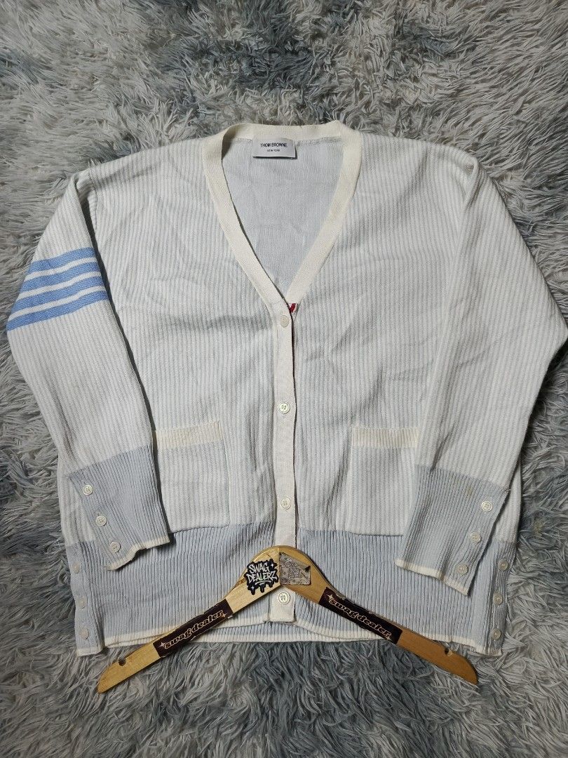 Thom Browne Pinstripe Cardigan (Category: Luxury Apparel) located in Manila. Submitted by swag_dealer (Listing ID 1448970753, Image 1). Description: Thom Browne Pinstripe Cardigan Fits M - L Length: 26 Width: 24 No wahtags Off only Need wash 800+sf.