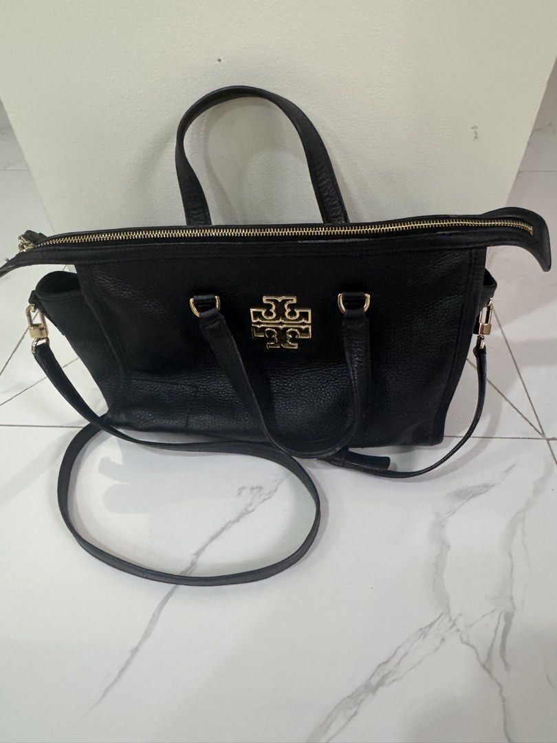 Tory Burch Black Leather Satchel Bag (Category: Luxury Bags & Wallets) located in Las Pinas. Submitted by vanethneth (Listing ID 1449007263, Image 1). Description: - Guaranteed Authentic Tory Burch black leather satchel, original price is $349 - Elegant gold hardware details - Features top handles and a detachable crossbody strap for versatile carrying - Secure zipper closure - Spacious interior with multiple compartments for organization - A cla