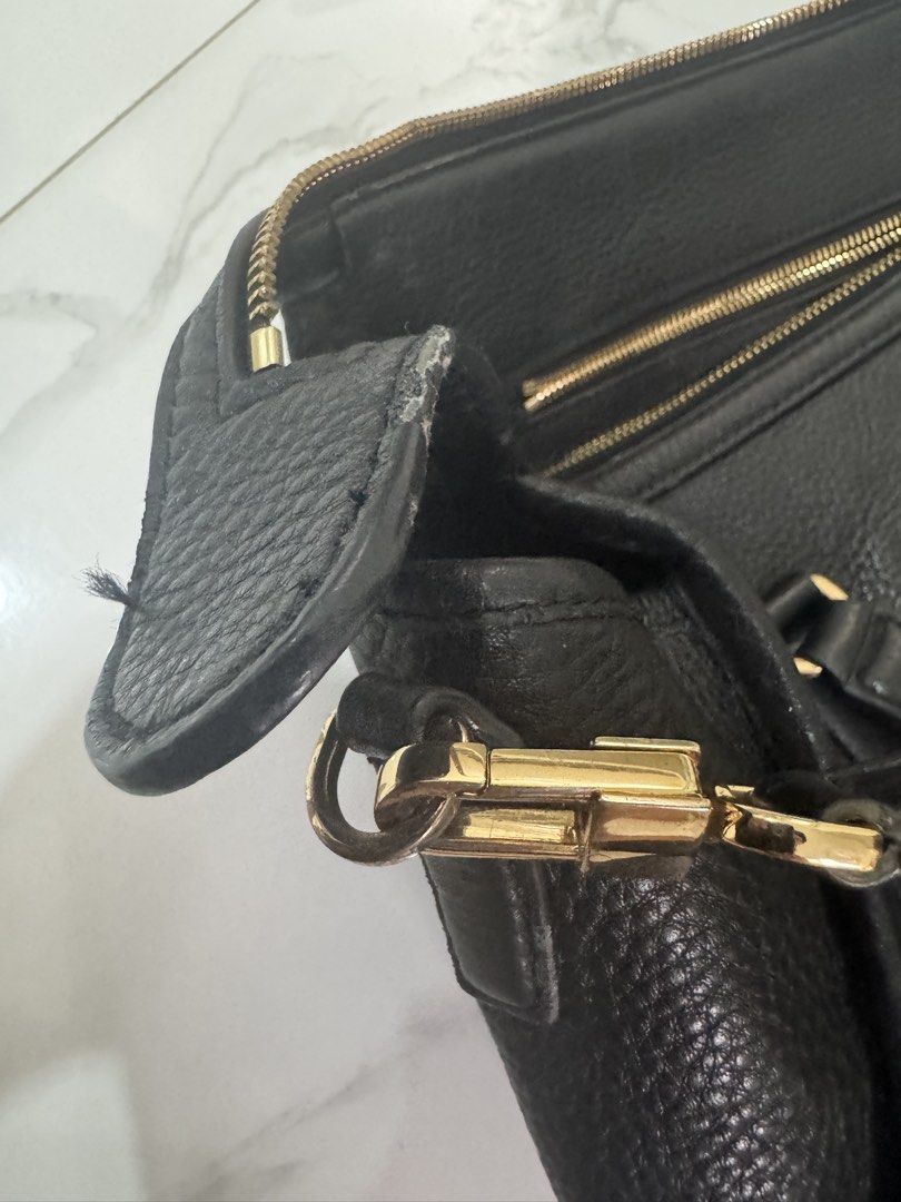 Tory Burch Black Leather Satchel Bag (Category: Luxury Bags & Wallets) located in Las Pinas. Submitted by vanethneth (Listing ID 1449007263, Image 3). Description: - Guaranteed Authentic Tory Burch black leather satchel, original price is $349 - Elegant gold hardware details - Features top handles and a detachable crossbody strap for versatile carrying - Secure zipper closure - Spacious interior with multiple compartments for organization - A cla