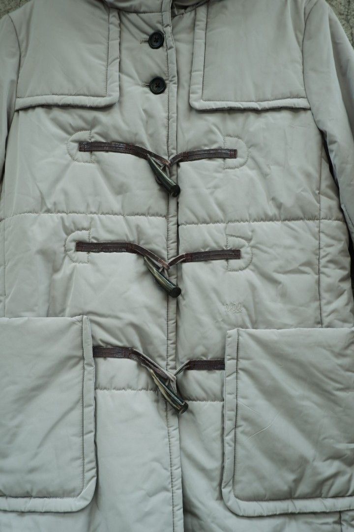 Undercover uniqlo quilted puffer toggle parka coat (Category: Coats, Jackets and Outerwear) located in Valenzuela. Submitted by henoh. (Listing ID 1449002977, Image 2). Description: in Collaboration between Undercover by Jun Takahashi and Uniqlo. A hooded duffle jacket features 3 fangs like closure in brown leather toggle and 4 upper button closure and 2 front pockets . size 8 medium on tag..