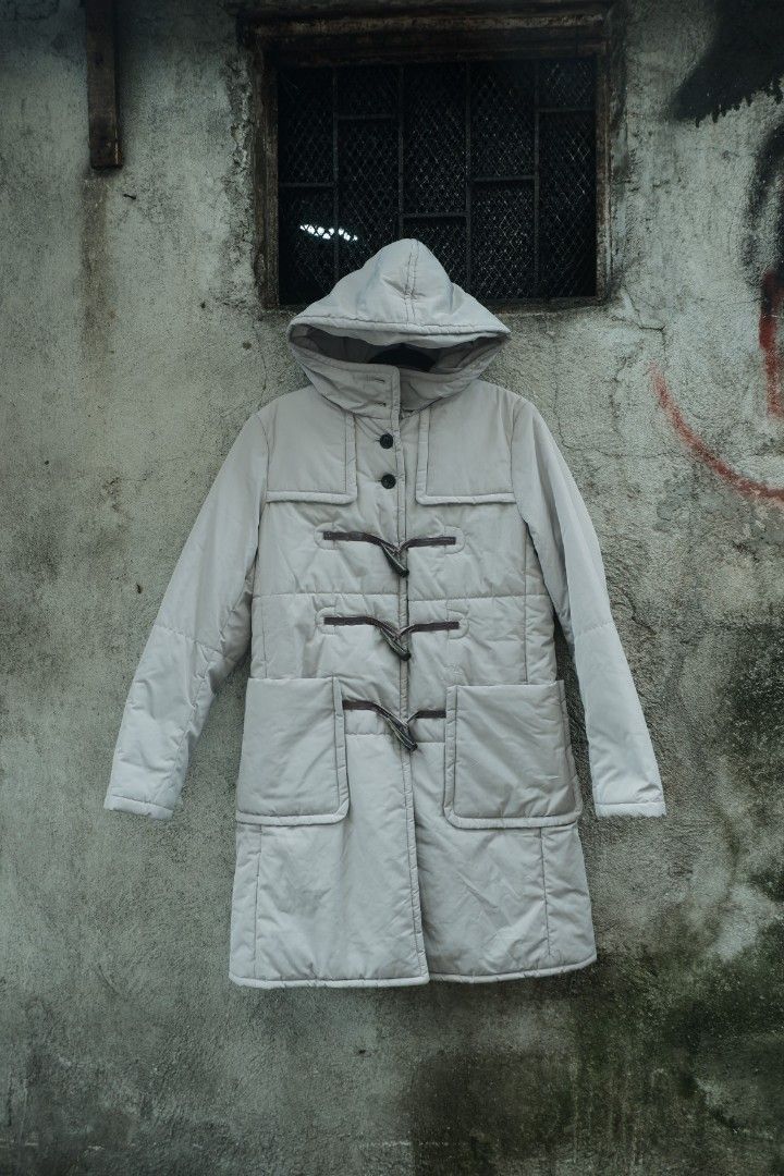 Undercover uniqlo quilted puffer toggle parka coat (Category: Coats, Jackets and Outerwear) located in Valenzuela. Submitted by henoh. (Listing ID 1449002977, Image 1). Description: in Collaboration between Undercover by Jun Takahashi and Uniqlo. A hooded duffle jacket features 3 fangs like closure in brown leather toggle and 4 upper button closure and 2 front pockets . size 8 medium on tag..