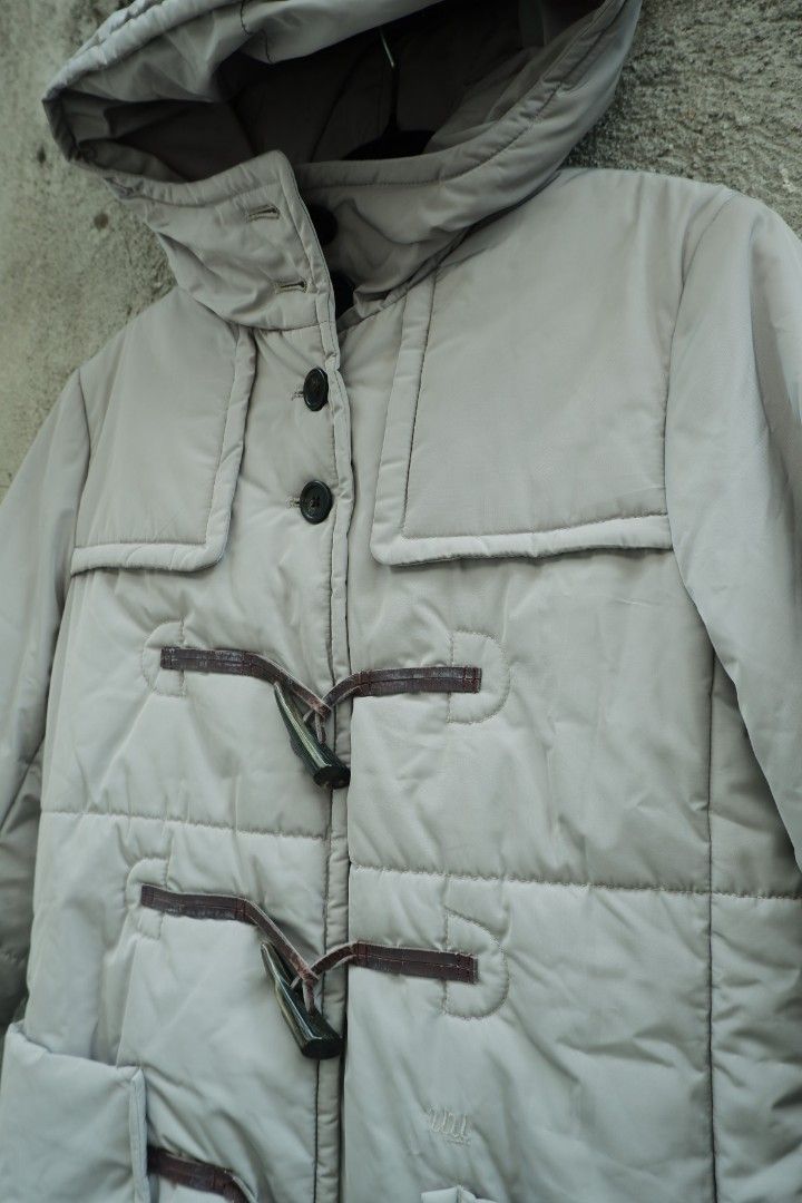 Undercover uniqlo quilted puffer toggle parka coat (Category: Coats, Jackets and Outerwear) located in Valenzuela. Submitted by henoh. (Listing ID 1449002977, Image 3). Description: in Collaboration between Undercover by Jun Takahashi and Uniqlo. A hooded duffle jacket features 3 fangs like closure in brown leather toggle and 4 upper button closure and 2 front pockets . size 8 medium on tag..