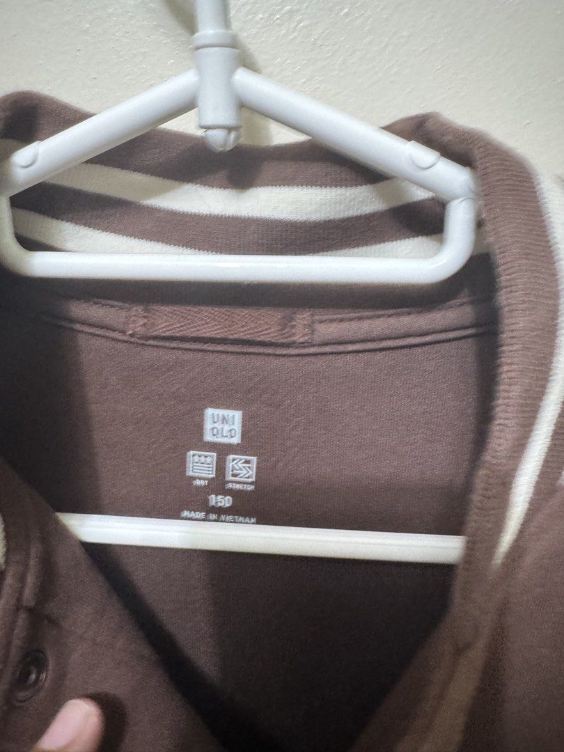 UNIQLO Brown Varsity Jacket (Category: Coats, Jackets and Outerwear) located in Quezon City. Submitted by weeklydeclutter (Listing ID 1448979222, Image 2). Description: - Uniqlo Brown Varsity Jacket - White Sleeves - Striped Collar, Cuffs, and Hem - 'H' Patch on Chest - Made in Vietnam - Ideal for Everyday Wear L- 22 w-18.