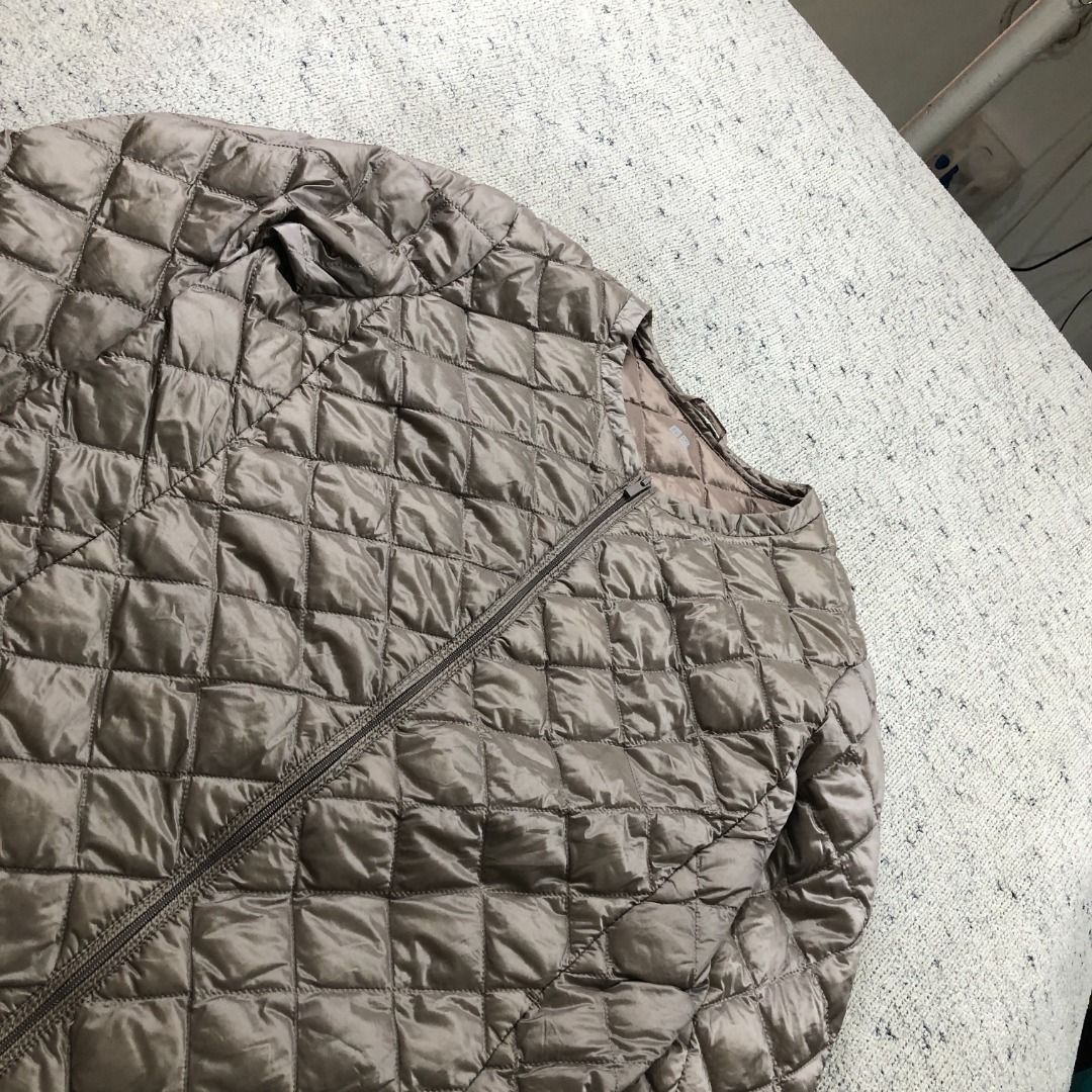 UNIQLO Ultra Light Down Quilted Jacket Collarless Bronze Size Medium (Category: Coats, Jackets and Outerwear) located in Santa Rosa. Submitted by sergids (Listing ID 1448920879, Image 1). Description: UNIQLO Ultra Light Down Quilted Jacket Collarless Bronze Size Medium Great condition. Check fitting tops to ensure this fits you. Dimensions below are exact measurements, see pics as well for comparison. 9/10 Condition and Colorway Dimensions: Check