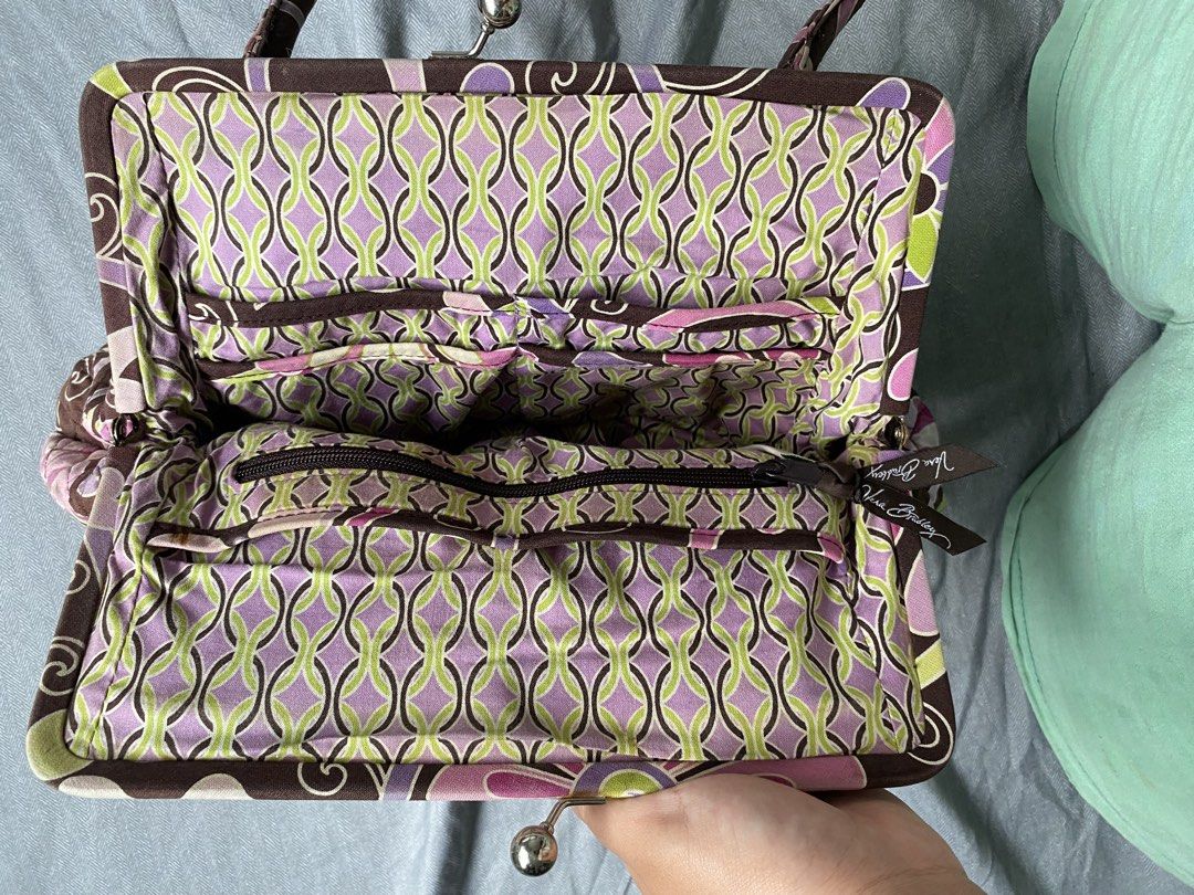 Vera Bradley Quilted Floral Purse (Category: Purses & Pouches) located in Las Pinas. Submitted by hannadeulsett (Listing ID 1448966652, Image 3). Description: Authentic, vintage Vera Bradley “Alice” handbag in the collectible Purple Punch floral pattern. Features a beautiful, sturdy silver kiss-lock frame closure that works perfectly. Condition: Pre-loved. Please note there is some visible fraying and light fading along the fabric piping/edges (s