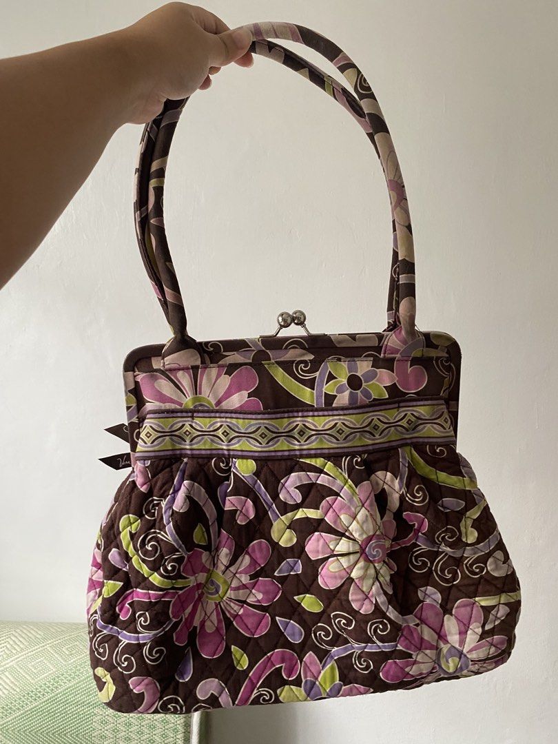 Vera Bradley Quilted Floral Purse (Category: Purses & Pouches) located in Las Pinas. Submitted by hannadeulsett (Listing ID 1448966652, Image 2). Description: Authentic, vintage Vera Bradley “Alice” handbag in the collectible Purple Punch floral pattern. Features a beautiful, sturdy silver kiss-lock frame closure that works perfectly. Condition: Pre-loved. Please note there is some visible fraying and light fading along the fabric piping/edges (s