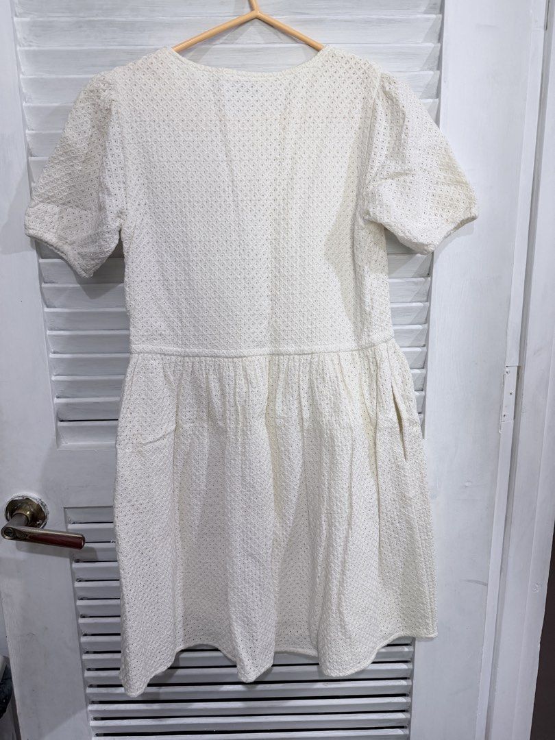 White Eyelet Button-Up Midi Dress with Pockets (Category: Dresses) located in Manila. Submitted by leyac (Listing ID 1449092393, Image 1). Description: - Cute white midi dress - Short puff sleeves - Button-up front - Gathered waistline - Flowy skirt - Side pockets - All-over eyelet texture fabric - Versatile for casual outings or dressing up - Croatia bought - Twice used and naka tambak na sa closet -Declutter.