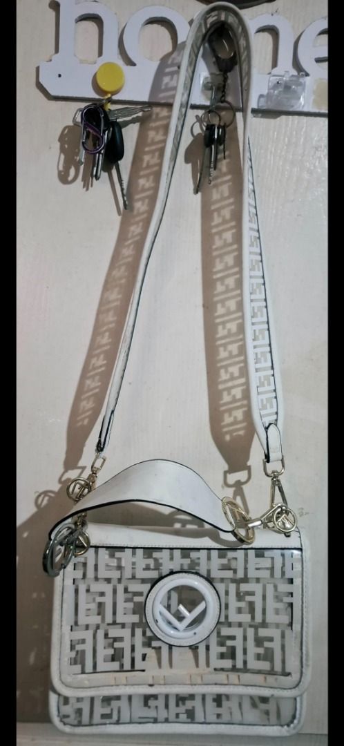 White Fendi Transparent Shoulder Bag (Category: Luxury Bags & Wallets) located in Cavite. Submitted by chinkee0215020 (Listing ID 1449101519, Image 1). Description: - Stylish white shoulder bag - Features transparent details - All-over Fendi logo pattern - Includes a detachable strap - Elegant gold hardware - Made in China - Ideal for everyday use.