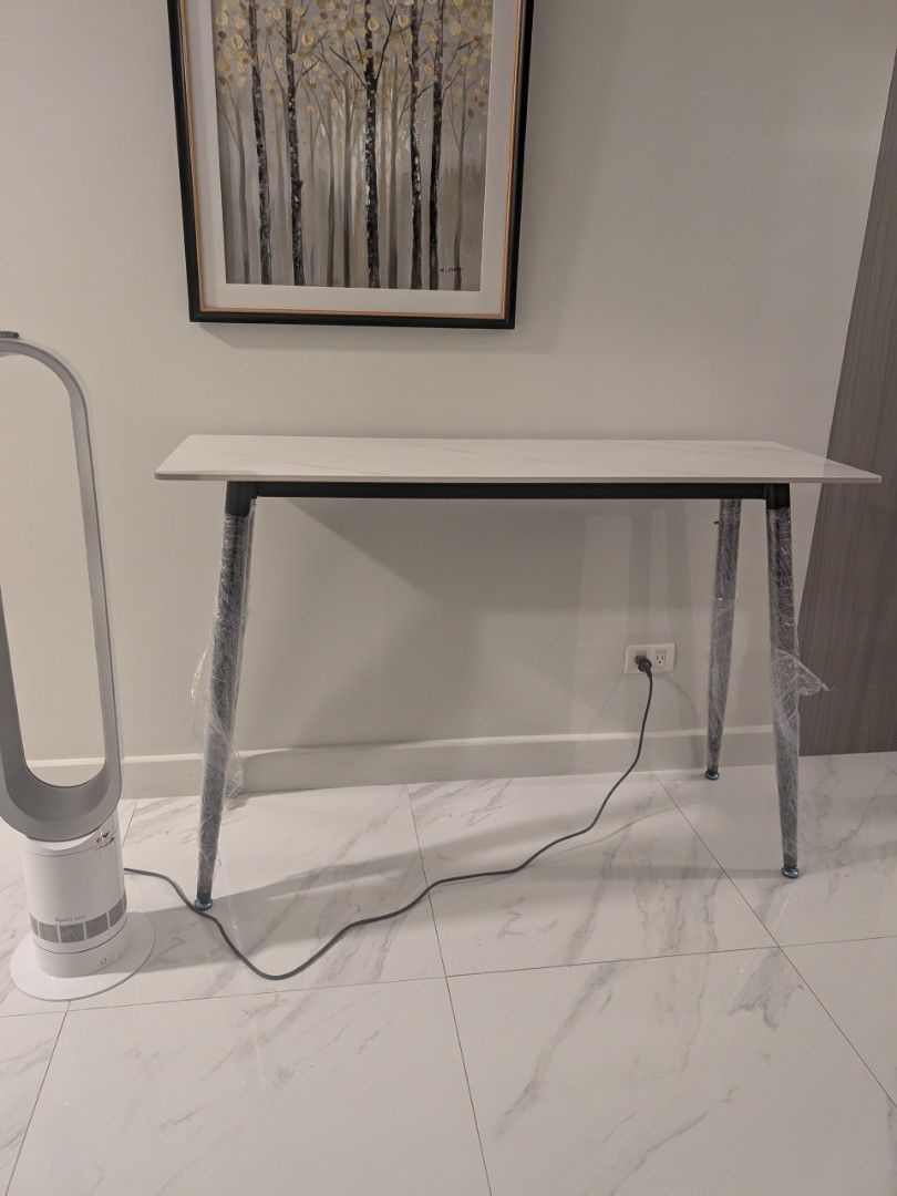 White Marble Top Console Table 120cm length and 81cm height (Category: Tables & Sets) located in Manila. Submitted by seanapaul (Listing ID 1445664702, Image 3). Description: White console side table - Marble-effect top - Sleek metal legs (protective plastic still on) - Ideal for hallways or as a display table - Approximately 120cm long 40cm depth 81cm height - Easy to clean surface - Modern home aesthetic pick up BGC.