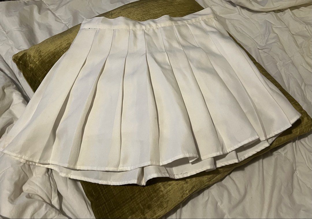 White Pleated Tennis Skirt (Category: Skirts) located in Marikina City. Submitted by danienbi (Listing ID 1449070293, Image 1). Description: - Classic white pleated skirt - Ideal for tennis or casual outfits - Features sharp, well-defined pleats - Versatile piece, easy to dress up or down - Pairs effortlessly with any top - Ready for a new owner!.