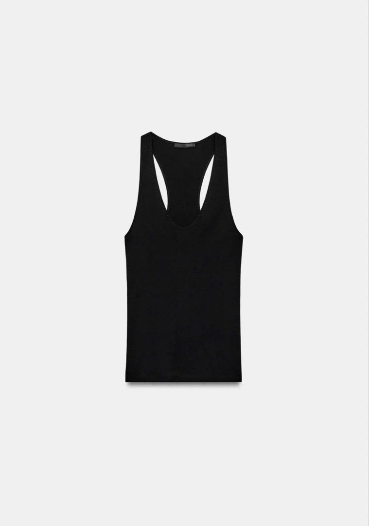 Zara Ribbed Tank Top Black Size S (Category: Sleeveless) located in Makati City. Submitted by elohenceee (Listing ID 1448946842, Image 3). Description: - Zara black ribbed tank top - Racerback style - Made with soft Supima cotton - Versatile for layering or wearing alone - Comfortable and essential piece RFS: I want more fitted will buy another.
