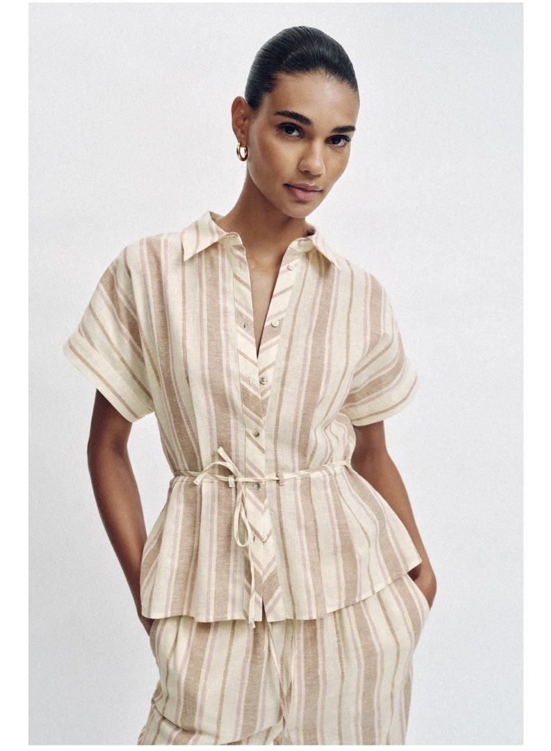 Zara Striped Peplum Shirt (Category: Shirts) located in Caloocan City. Submitted by kmlghr (Listing ID 1449035741, Image 2). Description: Chic Zara striped shirt in beige and pink with subtle gold thread detail. BRAND NEW w/ tag Size XS Orig Price: 2395.