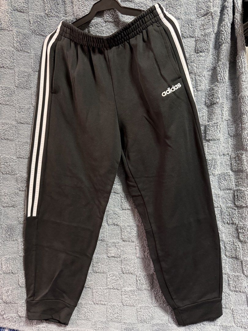 Adidas Black Track Pants with White Stripes - Size Medium (Category: Activewear) located in Manila. Submitted by payjo27 (Listing ID 1449134173, Image 1). Description: - unisex adidas track pants - medium on tag 📍Pasig City.