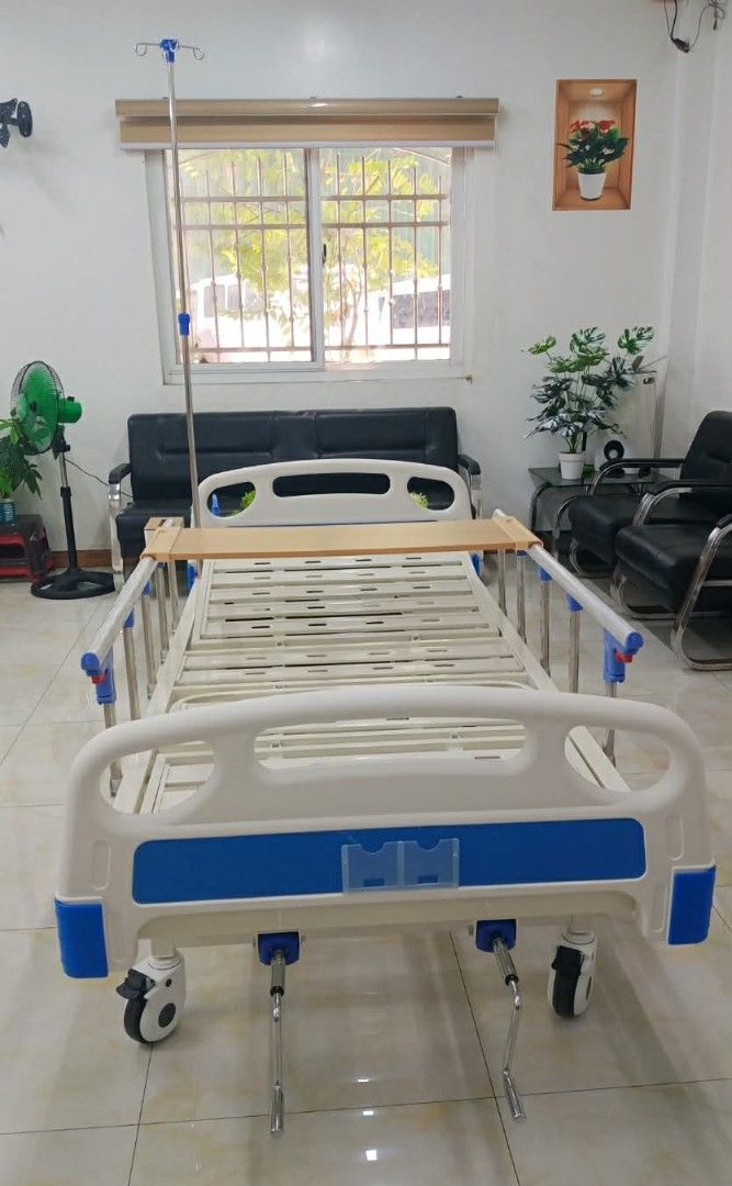 Adjustable Hospital Bed with IV Pole (Category: Medical Supplies & Tools) located in Mandaluyong City. Submitted by quickmountain.780662 (Listing ID 1449249536, Image 2). Description: - Adjustable hospital bed - Includes IV pole - White and blue frame - Equipped with wheels for easy mobility - Perfect for home care or medical facilities - Ready for pickup.