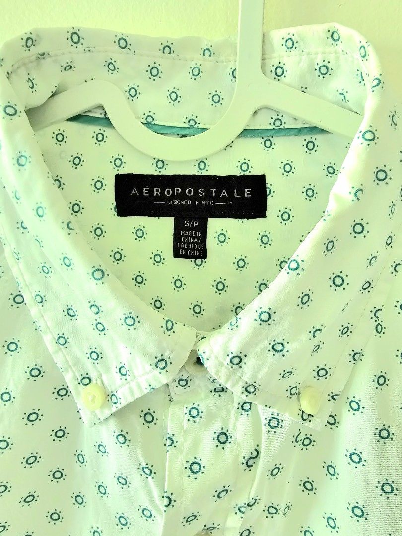 Aeropostale Short Sleeve Shirt (Category: Tshirts & Polo Shirts ) located in Quezon City. Submitted by dbjhub (Listing ID 1432891521, Image 2). Description: - Aeropostale short sleeve shirt - Unique teal pattern on white - Button-down style - Collared neckline - Classic fit - Perfect for casual wear.