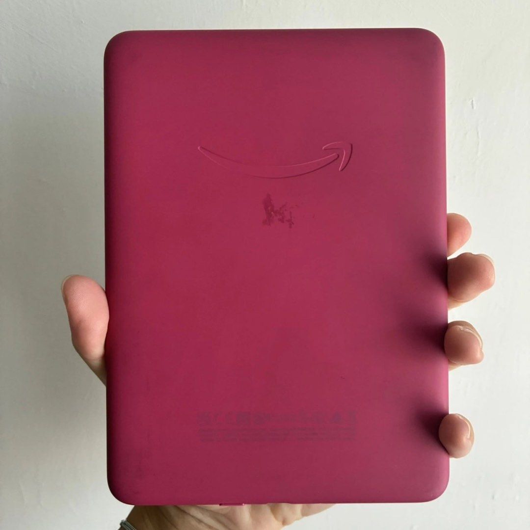 Kindle Paperwhite 12th Generation 16GB SA568B Raspberry (Category: E-Readers) located in Manila. Submitted by fromdublin.withlove (Listing ID 1449251692, Image 3). Description: Fully working, factory reset and deregistered from Amazon account. Very good overall condition with some minor marks/scratches from previous use and a patch of sticky residue on the rear. Please view all photos for the best description of condition. Original box and chargi