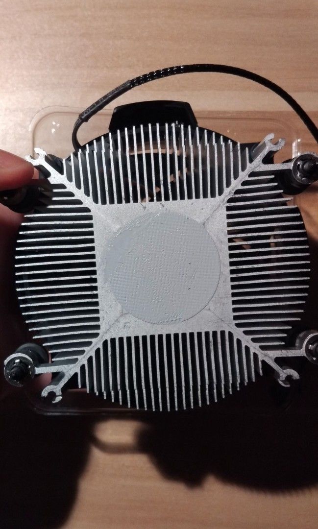 AMD Wraith Stealth CPU Stock Cooler + Arctic MX-6 Thermal Paste (Category: Computer Parts) located in Mandaluyong City. Submitted by passthetreasure (Listing ID 1449316221, Image 3). Description: • Thermal Paste was accidentally smeared 🫠 • Includes an Arctic MX-6 Thermal Paste.