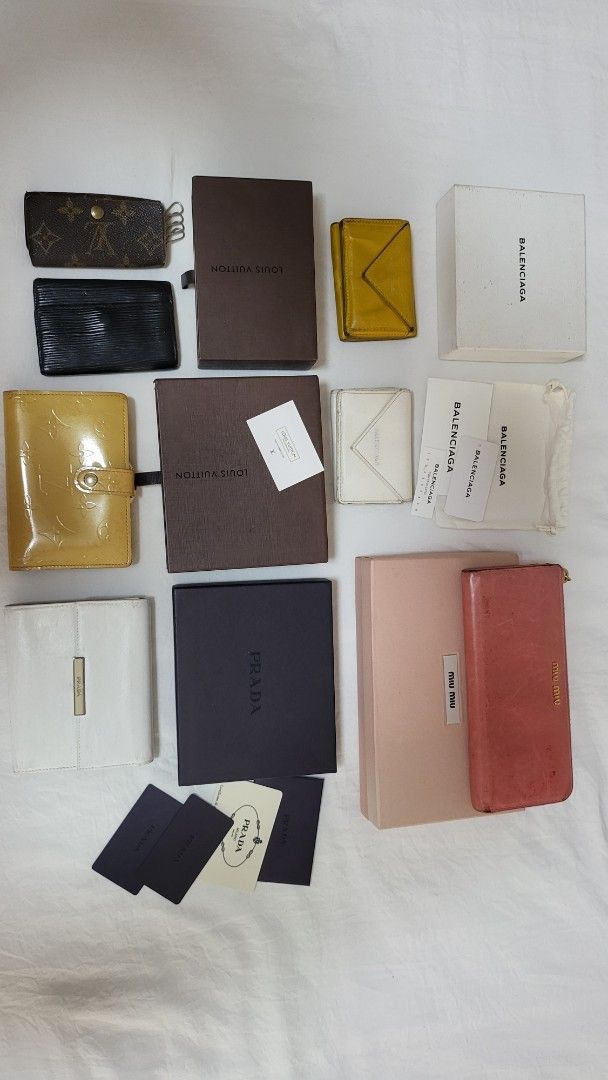Authentic Bundle (Category: Luxury Bags & Wallets) located in Quezon City. Submitted by bonching (Listing ID 1449157635, Image 1). Description: - Bundle of designer accessories - Includes Trifold Balenciaga cardholders a - Louis Vuitton monogram key holder and Vernis - Miu Miu pink wallet and box - Prada white wallet - Comes with boxes and authenticity cards - Perfect for luxury accessory enthusiasts.