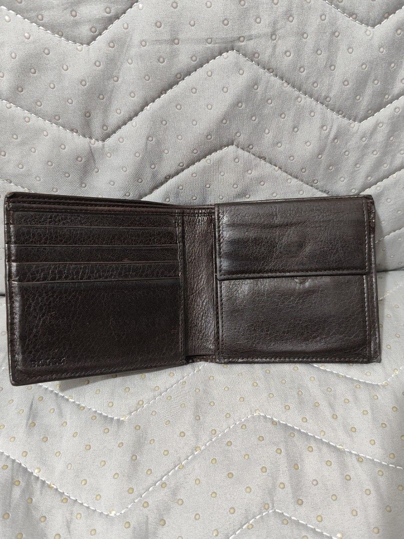 Bally Leather Bifold Wallet (Category: Luxury Bags & Wallets) located in Bulacan. Submitted by abejeroamy80846 (Listing ID 1449292503, Image 3). Description: - Genuine Bally brown leather bifold wallet - Iconic Bally stripe detail on the front corner - Ample card slots for all your essentials - Convenient coin pocket included - Perfect for daily use.