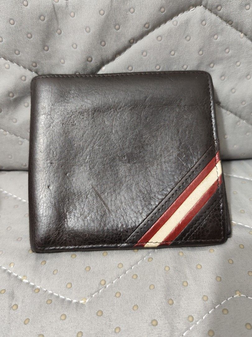 Bally Leather Bifold Wallet (Category: Luxury Bags & Wallets) located in Bulacan. Submitted by abejeroamy80846 (Listing ID 1449292503, Image 1). Description: - Genuine Bally brown leather bifold wallet - Iconic Bally stripe detail on the front corner - Ample card slots for all your essentials - Convenient coin pocket included - Perfect for daily use.