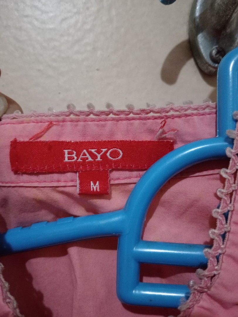 BAYO Pink Mandarin Collar Button Down Shirt Size M (Category: Blouses) located in Makati City. Submitted by YSL80022 (Listing ID 1449244538, Image 3). Description: - Brand: BAYO - Color: Pink - Style: Mandarin Collar, Button-Down Shirt - Sleeves: Long with button cuffs - Details: Pintuck details on the front - Size: Medium (M) - Occasion: Ideal for casual or smart casual outfits RFS: weight gain.