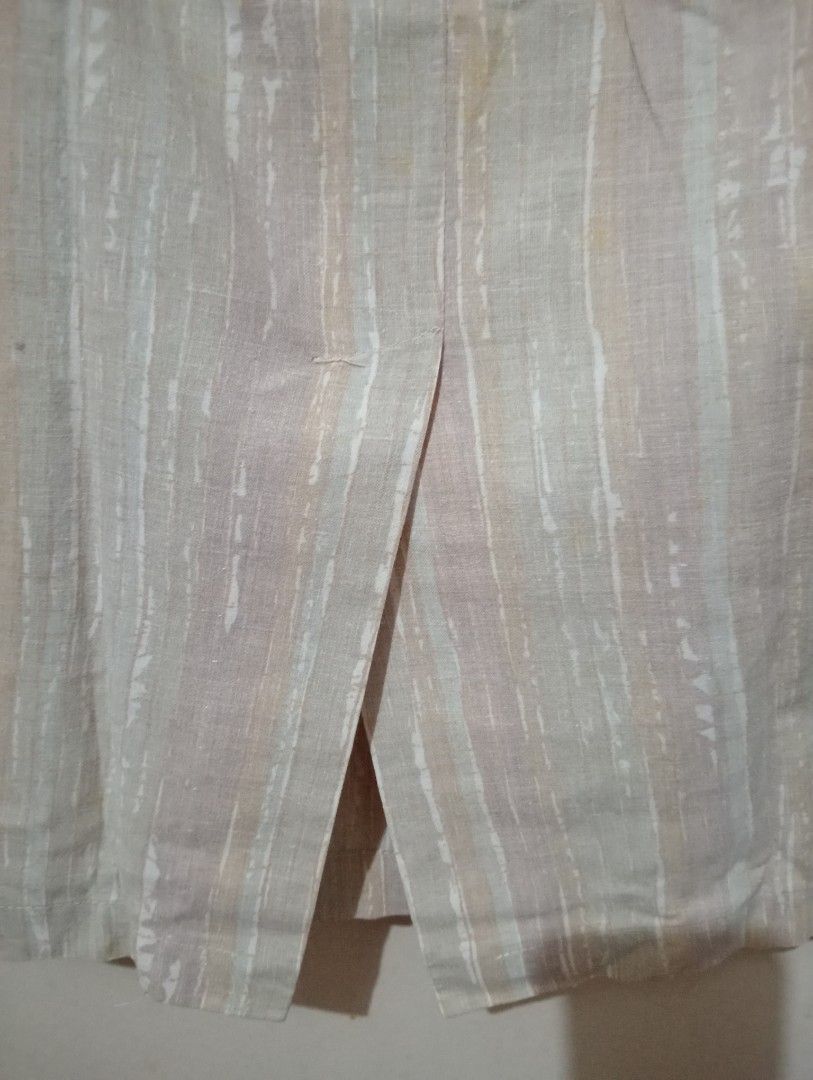 Beige Striped Pencil Skirt with Front Slit (Category: Skirts) located in Makati City. Submitted by YSL80022 (Listing ID 1449250435, Image 3). Description: - Beige pencil skirt - Vertical stripes - Front slit for easy movement - Linen blend look - Versatile for work or casual wear - Simple and classic design - waist: 30 inches - length: 24 inches RFS: weight gain.