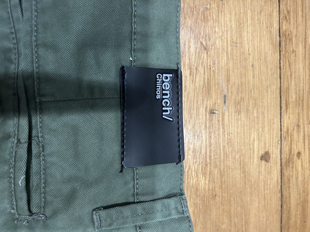 Bench Chinos Shorts Size 36 (Category: Chinos) located in Manila. Submitted by Declutterland (Listing ID 1449267276, Image 2). Description: - Army Green Bench Chinos Shorts - Size: 36 - Material: 100% Natural Cotton - Care: Machine or hand wash cold, non-chlorine bleach, tumble dry low, iron high - Origin: Made in the Philippines - Style: Great for casual wear - never used Length: 22.5 inches.