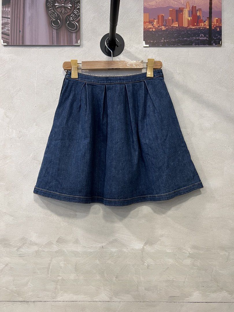 Burberry Blue Label Denim Skirt (Category: Skirts) located in Manila. Submitted by -handpick- (Listing ID 1449282520, Image 2). Description: - Burberry Blue Label denim skirt - Features front pleats for a flattering flared silhouette - Classic blue wash for versatile styling - Ideal for casual everyday wear - Effortlessly pairs with various tops and footwear Size : 38 Dimensions : Length : 18 inches Waistline : 26 inches.
