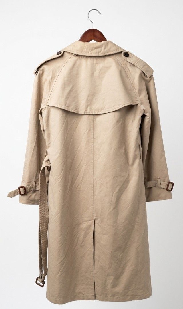 Burberry Classic Beige Trench Coat with Nova Check Lining (Category: Coats, Jackets and Outerwear) located in Naga. Submitted by solamia (Listing ID 1449175371, Image 3). Description: - Classic beige trench coat - Features iconic Nova Check lining - Double-breasted design - Belted waist for adjustable fit - Ideal for layering over any outfit - Timeless and versatile wardrobe staple welcome offers.