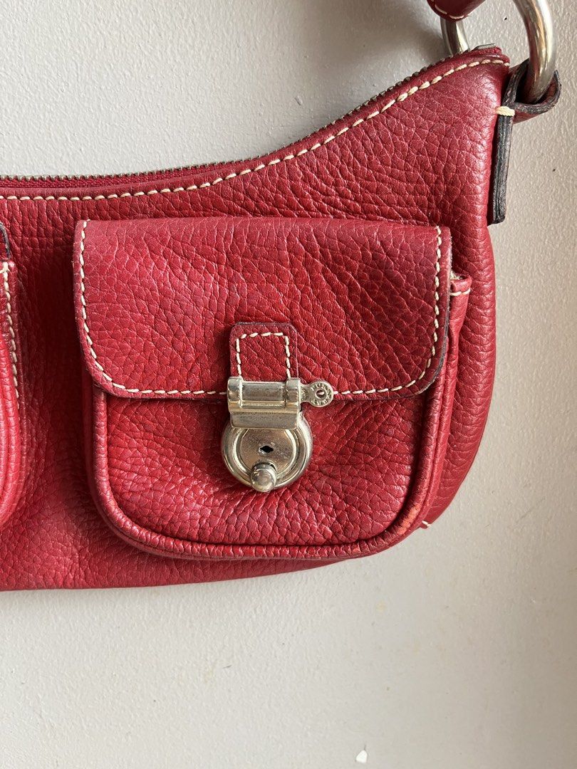 Burberry Red Leather Shoulder Bag (Category: Luxury Bags & Wallets) located in Cebu City. Submitted by agathallamera (Listing ID 1449232068, Image 3). Description: - Authentic Burberry red leather shoulder bag - Elegant silver hardware details - Two functional front pockets with secure closures - Convenient zip top closure - Iconic Burberry check lining inside - Minor marks on interior lining, does not affect overall appearance - Ideal for everyd