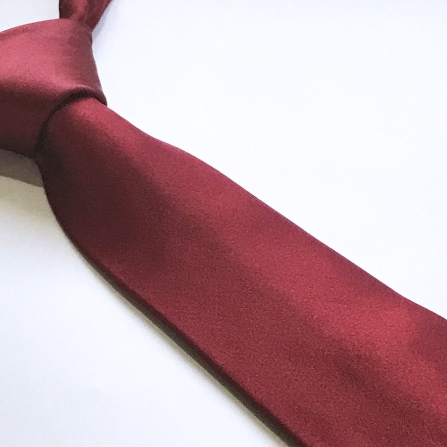 Burma Bibas Plain Burgundy Silk Tie (Category: Ties) located in Taguig. Submitted by retrogaze (Listing ID 1449166071, Image 1). Description: This timeless necktie by Burma Bibas is crafted from 100% premium silk. It features a solid, plain burgundy base with a rich, matte-like texture that catches the light with subtle sophistication. The back is securely finished with a keeper loop and the brand's classic woven label, ensuring both style and du