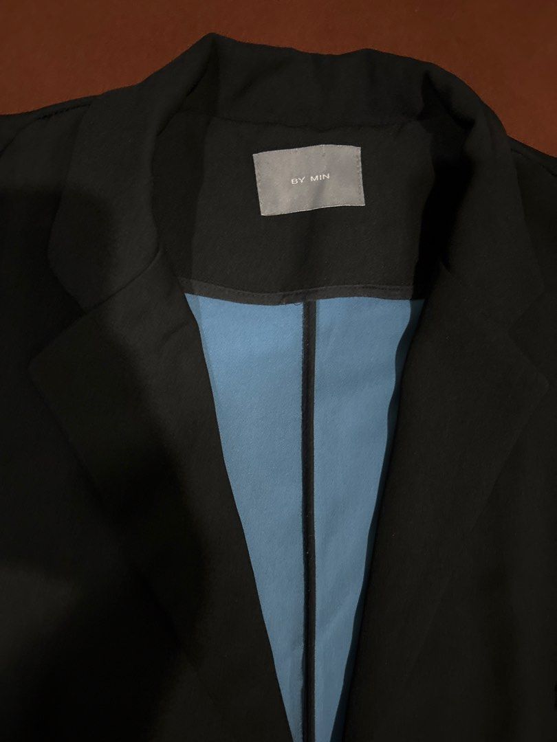 by.min Black Blazer with Blue Lining (Category: Coats, Jackets and Outerwear) located in Caloocan City. Submitted by declutterieee (Listing ID 1449260718, Image 3). Description: - BY.MIN black blazer - Contrasting bright blue lining - Cuffed sleeves revealing blue lining - Two front pockets - Ideal for layering and adding a sharp, stylish touch to any outfit.