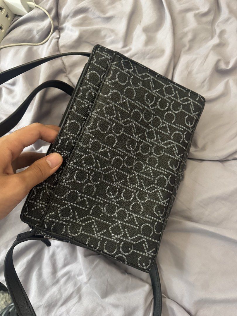 calvin klein monogram sling bag (Category: Cross-body Bags) located in Manila. Submitted by ecooo (Listing ID 1449187264, Image 3). Description: used like new unisex ingood conditiom.