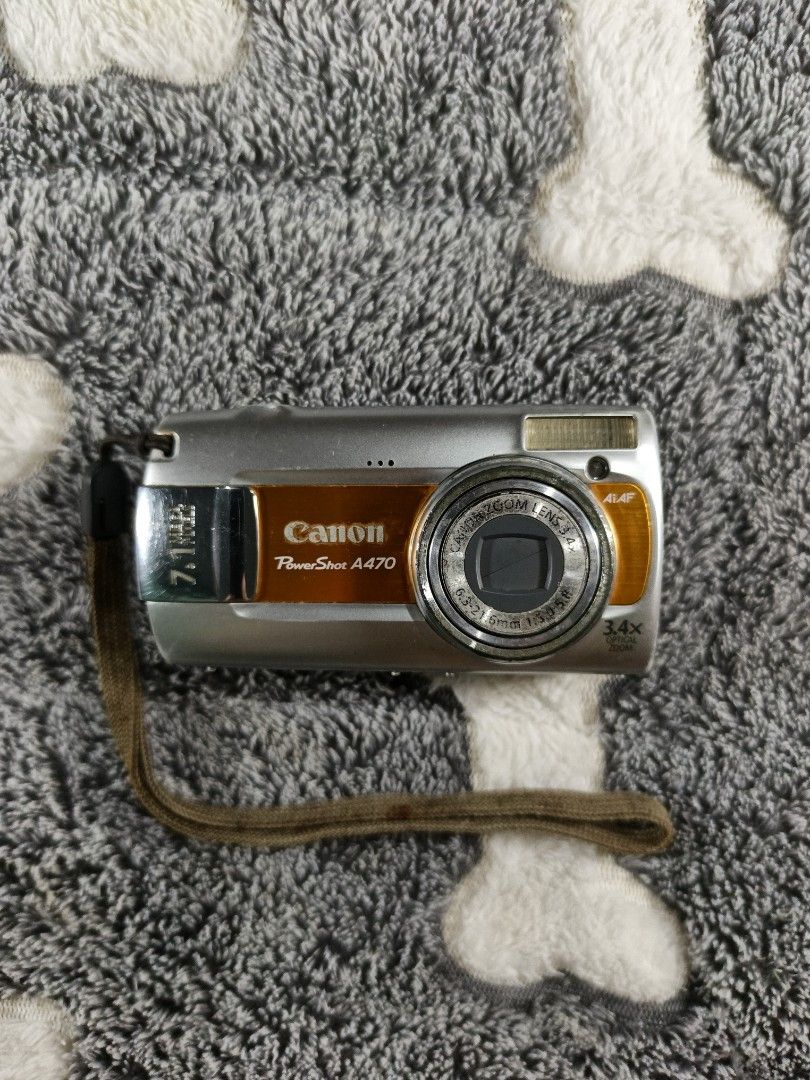 Canon PowerShot A470 Digital Camera (Category: Cameras) located in Mabalacat. Submitted by by.mo_nograph (Listing ID 1449284993, Image 1). Description: Free shipping! - Canon PowerShot A470 Digital Camera - 7.1 Megapixels - 3x Optical Zoom - Includes Wrist S trap - Tested and Working - Minor signs of wear on the body - Perfect for casual, simple point-and-shoot photography Issues: lcd burn overexposure sensor issue.