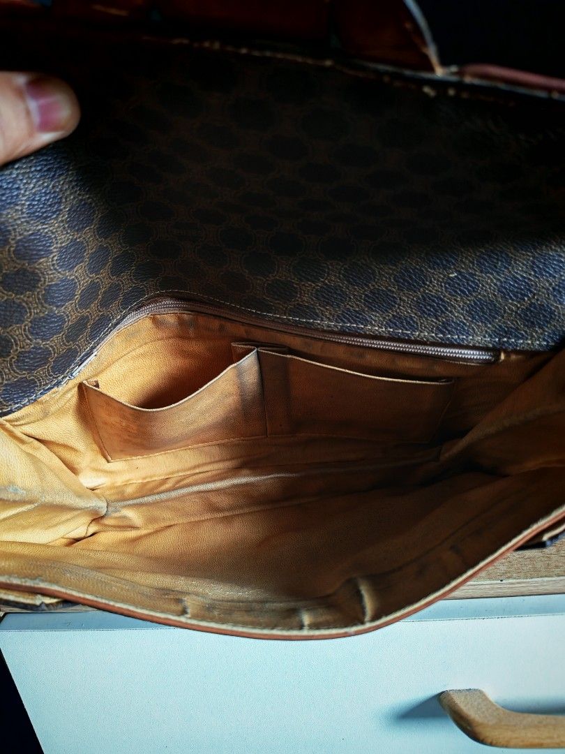 Celine Macadam Pattern Leather Clutch Bag (Category: Luxury Bags & Wallets) located in Manila. Submitted by cleverwhale_45b7bc (Listing ID 1449189593, Image 3). Description: - Authentic Vintage Celine Clutch Bag - Iconic Macadam Pattern - Classic Brown and Tan Colorway - Genuine Leather Trim and Strap Closure - Interior Features Multiple Compartments and a Zippered Pocket - Made in Italy.