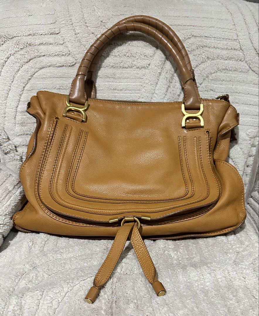 Chloe Marcie Large Satchel Bag (Category: Luxury Bags & Wallets) located in Quezon City. Submitted by marengcondo (Listing ID 1449252710, Image 1). Description: MAJOR DECLUTTERING ONGOING 😅 - Authentic Chloe Marcie satchel - Color: Brown leather - Size: Medium - Features: Signature stitching, rolled leather handles, front zip pocket, leather tassels - Hardware: Gold - Style: Classic, perfect for everyday wear Will try to take more photos soon, b