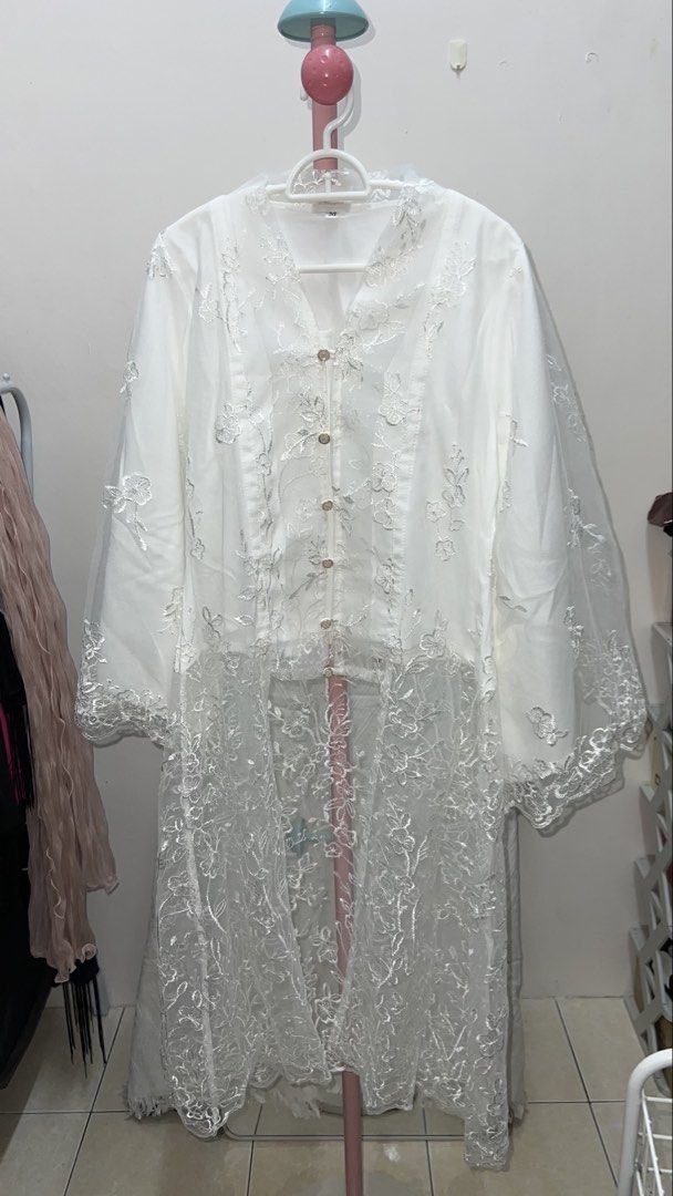 CHOMEL by ceochomel Kurung Kimono White Lace Set (Category: Baju Kurung & sets) located in Kuala Lumpur. Submitted by pretty.relove (Listing ID 1449230702, Image 1). Description: - White lace kurung top and skirt set - Beautiful all-over floral embroidery - Kimono-style top with button closure - Sheer lace sleeves and hem - Matching long skirt with elastic waistband - Perfect for special occasions or festive wear - Refer to size chart for measure