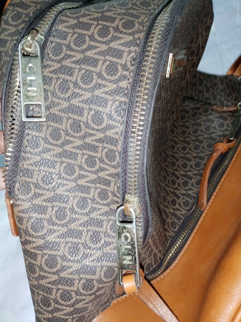 CLN Backpack Monogram Brown Leather Accents (Category: Backpacks) located in Makati City. Submitted by comoro (Listing ID 1449155288, Image 2). Description: - Stylish brown monogram backpack - Genuine leather accents - Multiple zippered compartments and internal pockets - Adjustable straps for comfortable wear - Perfect for daily commutes or travel - Shows some signs of wear on leather trim.