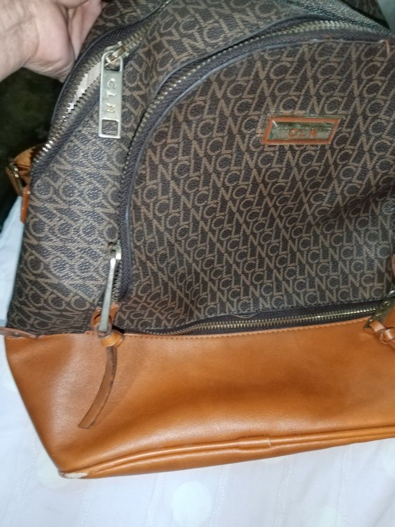 CLN Backpack Monogram Brown Leather Accents (Category: Backpacks) located in Makati City. Submitted by comoro (Listing ID 1449155288, Image 3). Description: - Stylish brown monogram backpack - Genuine leather accents - Multiple zippered compartments and internal pockets - Adjustable straps for comfortable wear - Perfect for daily commutes or travel - Shows some signs of wear on leather trim.
