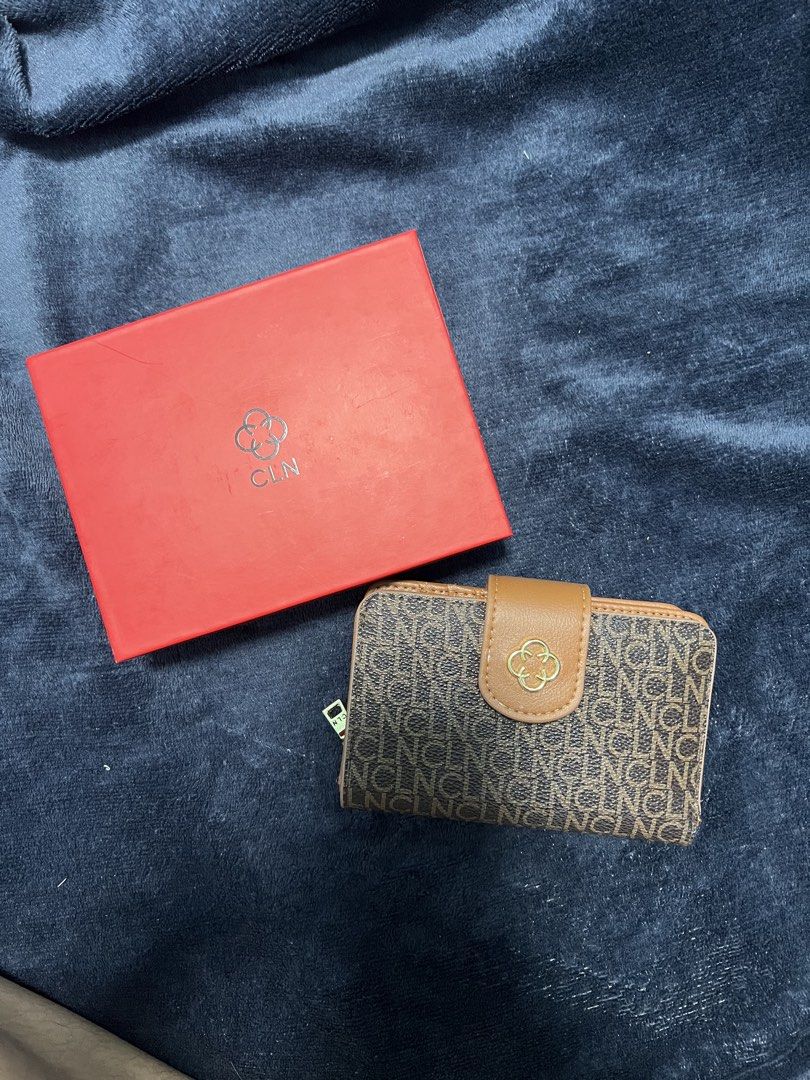 CLN Brown Monogrammed Wallet with Box and Bag (Category: Wallets & Card holders) located in Prosperidad. Submitted by stuffby_deni (Listing ID 1449159164, Image 1). Description: - Brown CLN wallet with signature monogram pattern - Includes original red box and red shopping bag - Tan interior with multiple card slots - Features a dedicated coin compartment - Secure snap closure - Ideal for everyday use.