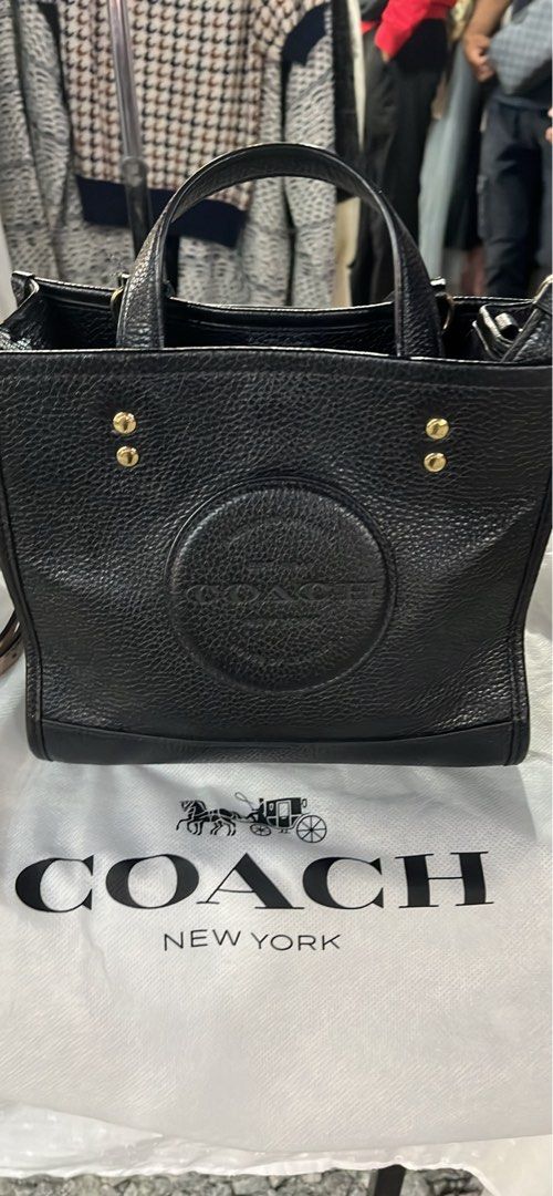 Coach Black Leather Tote Bag (Category: Tote Bags) located in Sepang. Submitted by goodthingscometothosewhowait (Listing ID 1449278918, Image 1). Description: - Coach black pebbled leather tote bag - Top handles - Detachable crossbody strap - Interior pockets - Comes with dust bag - Made in Indonesia Original price RM2750.00 - Model number: CA177.