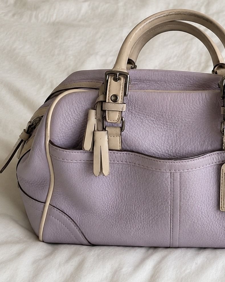 Coach Lavender Leather Boston Bag (Category: Luxury Bags & Wallets) located in Caloocan City. Submitted by maebirayd (Listing ID 1449281612, Image 2). Description: Coach bag in a lovely lavender color. Features light beige leather trim and handles. Has exterior pockets for easy access. The leather has a nice textured finish. Comes with leather tassels. A classic Coach design..