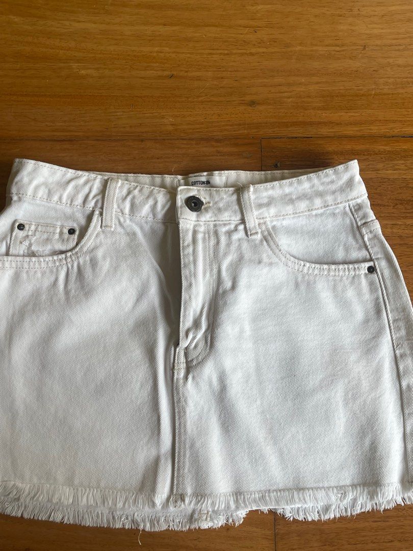 Cotton On White Denim Micro Mini Skirt (Category: Skirts) located in Makati City. Submitted by jmieiii (Listing ID 1449138032, Image 3). Description: - White denim mini skirt from Cotton On - Features a trendy frayed hem - Classic five-pocket design - Secure zip and button closure - Versatile for dressing up or down - Ideal for your summer wardrobe.