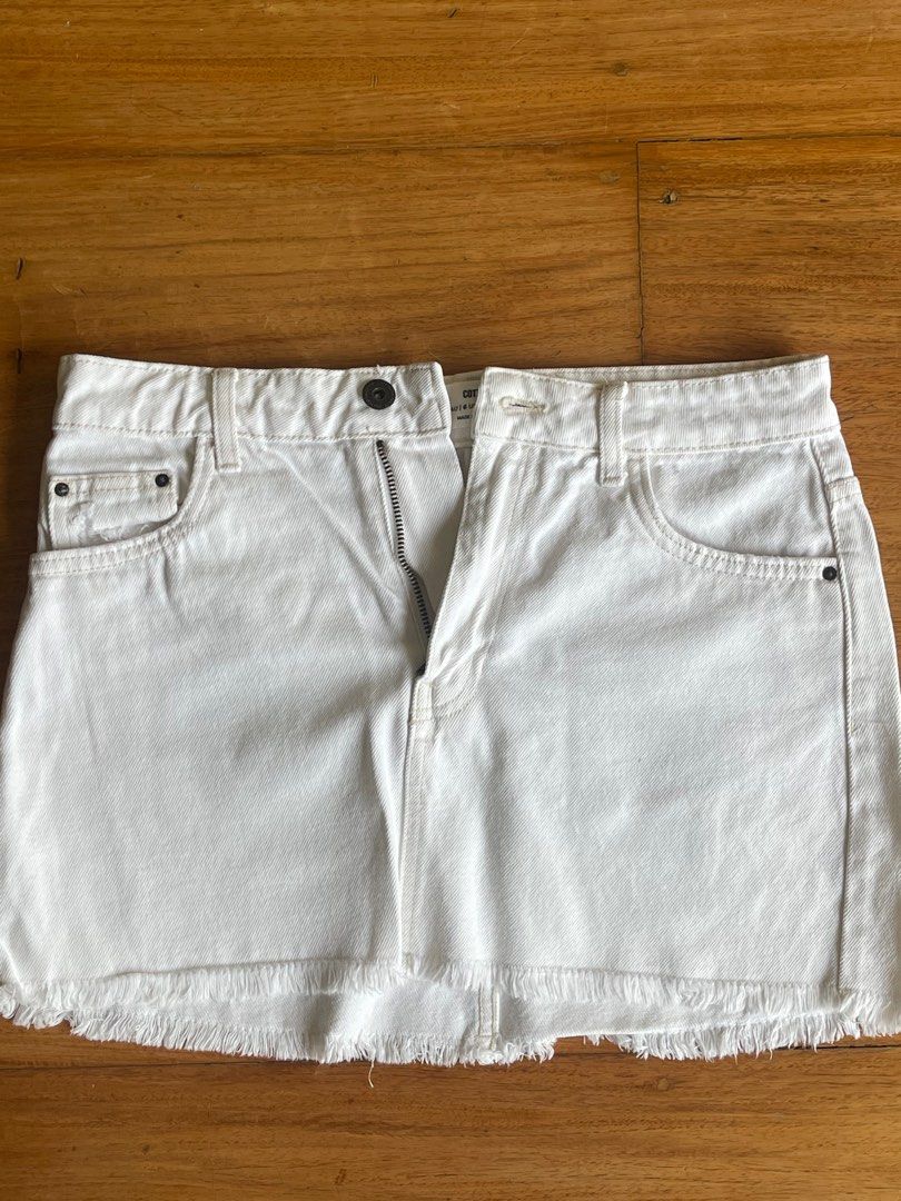 Cotton On White Denim Micro Mini Skirt (Category: Skirts) located in Makati City. Submitted by jmieiii (Listing ID 1449138032, Image 1). Description: - White denim mini skirt from Cotton On - Features a trendy frayed hem - Classic five-pocket design - Secure zip and button closure - Versatile for dressing up or down - Ideal for your summer wardrobe.