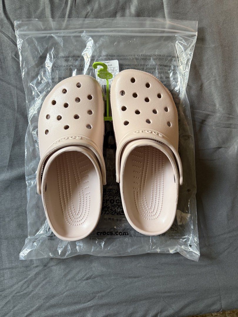 Crocs Classic Clogs (M6/W8) (Category: Slippers and slides) located in Angeles City. Submitted by decluttering.kimmmyyy (Listing ID 1449220165, Image 2). Description: Please see all details below: - Classic Crocs clogs - Color: Quartz - Size: M6/W8 - Condition: Brand new, still in original plastic packaging - Bought in US - RFS: extra pair.