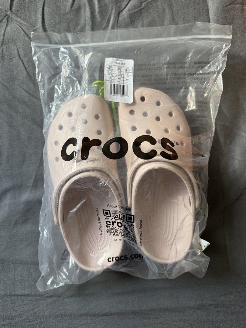 Crocs Classic Clogs (M6/W8) (Category: Slippers and slides) located in Angeles City. Submitted by decluttering.kimmmyyy (Listing ID 1449220165, Image 1). Description: Please see all details below: - Classic Crocs clogs - Color: Quartz - Size: M6/W8 - Condition: Brand new, still in original plastic packaging - Bought in US - RFS: extra pair.