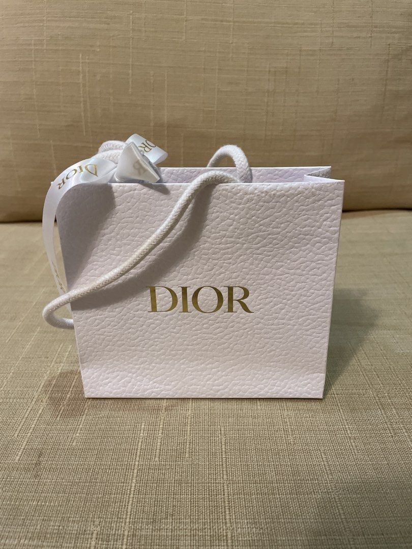 Dior Shopping Bag (Category: Luxury Bags & Wallets) located in Cebu City. Submitted by kiki_closet168 (Listing ID 1449267783, Image 2). Description: - Authentic Dior shopping bag - mini size for makeup - Includes ribbon tie Dimension 5.5in x 5in x 1.75in.