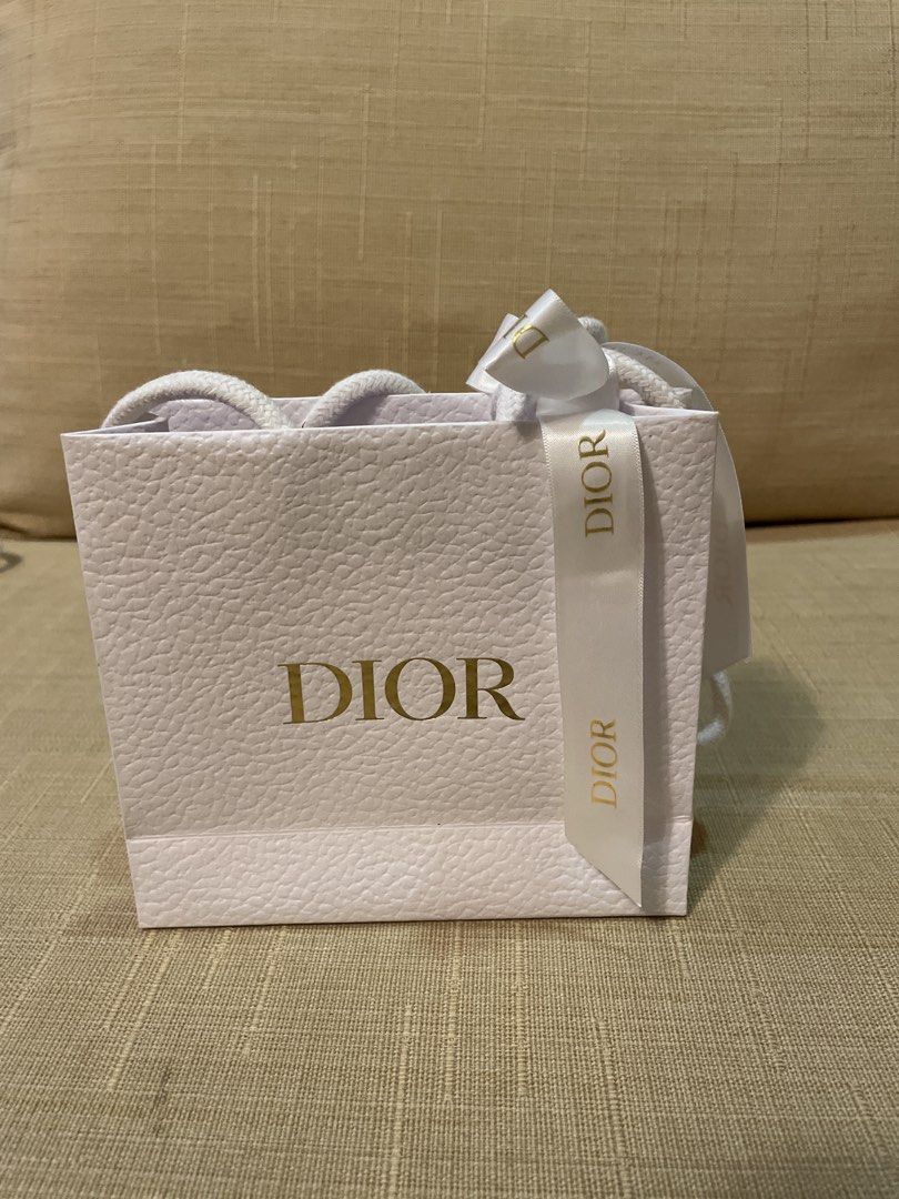 Dior Shopping Bag (Category: Luxury Bags & Wallets) located in Cebu City. Submitted by kiki_closet168 (Listing ID 1449267783, Image 1). Description: - Authentic Dior shopping bag - mini size for makeup - Includes ribbon tie Dimension 5.5in x 5in x 1.75in.