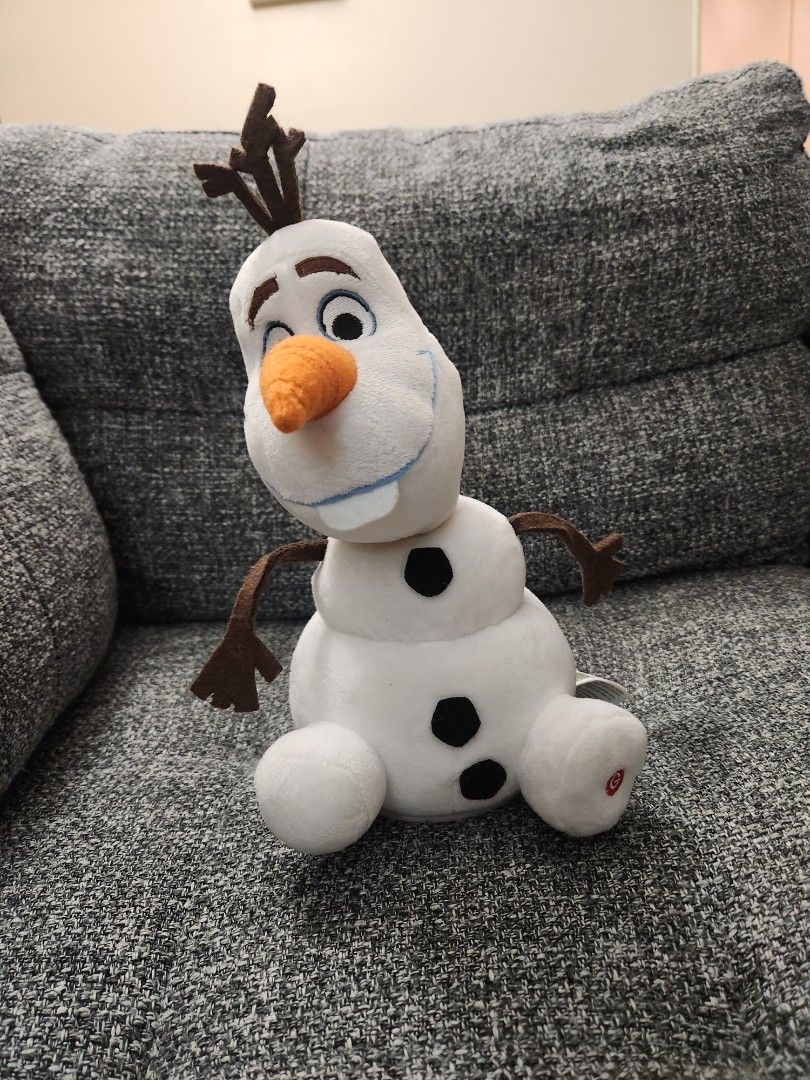 Disney Olaf Dancing Musical Frozen Plush Toy (Category: Toys) located in North York. Submitted by real_reah (Listing ID 1449117798, Image 1). Description: This is a Disney Olaf soft plush toy from Frozen. It's white with his signature orange carrot nose and brown twig arms. It is soft and plush and can also dance when button is pressed. ON/Off button for music is on foot. Music and dancing is battery operated and can be turned on & off. AA Batter