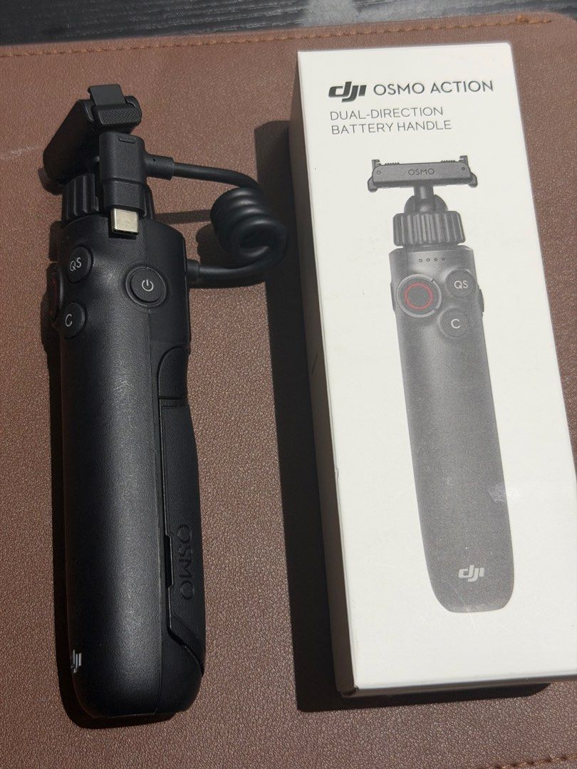 DJI Osmo Action Dual-Direction Battery Handle (Category: Cameras) located in Mabalacat. Submitted by tinedpsalvador_on_ig (Listing ID 1449177603, Image 1). Description: - USED ONCE, Perfectly working - DJI Osmo Action Dual-Direction Battery Handle - Color: Black - Includes: Original handle and box - Model Number: BPFXNAH00A023A - Manufacturing Date: October 2025.
